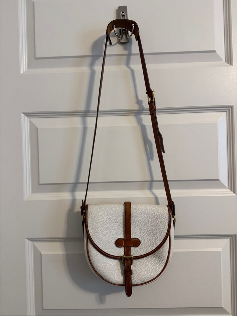 Dooney & Boorke White Pebbled Crossbody with Brown Trim and Adjustable Strap